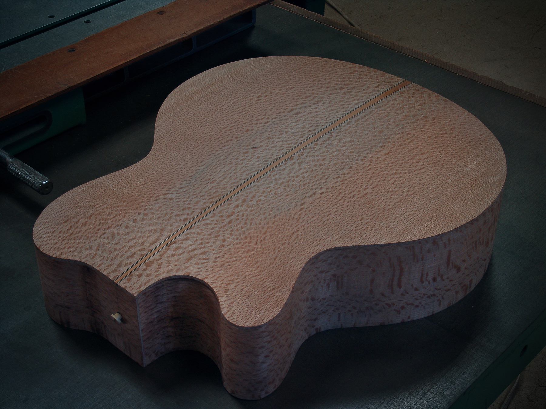 Guitar maker Peter Stephen acoustic cutaway guitar back and sides awaits the next stage of construction