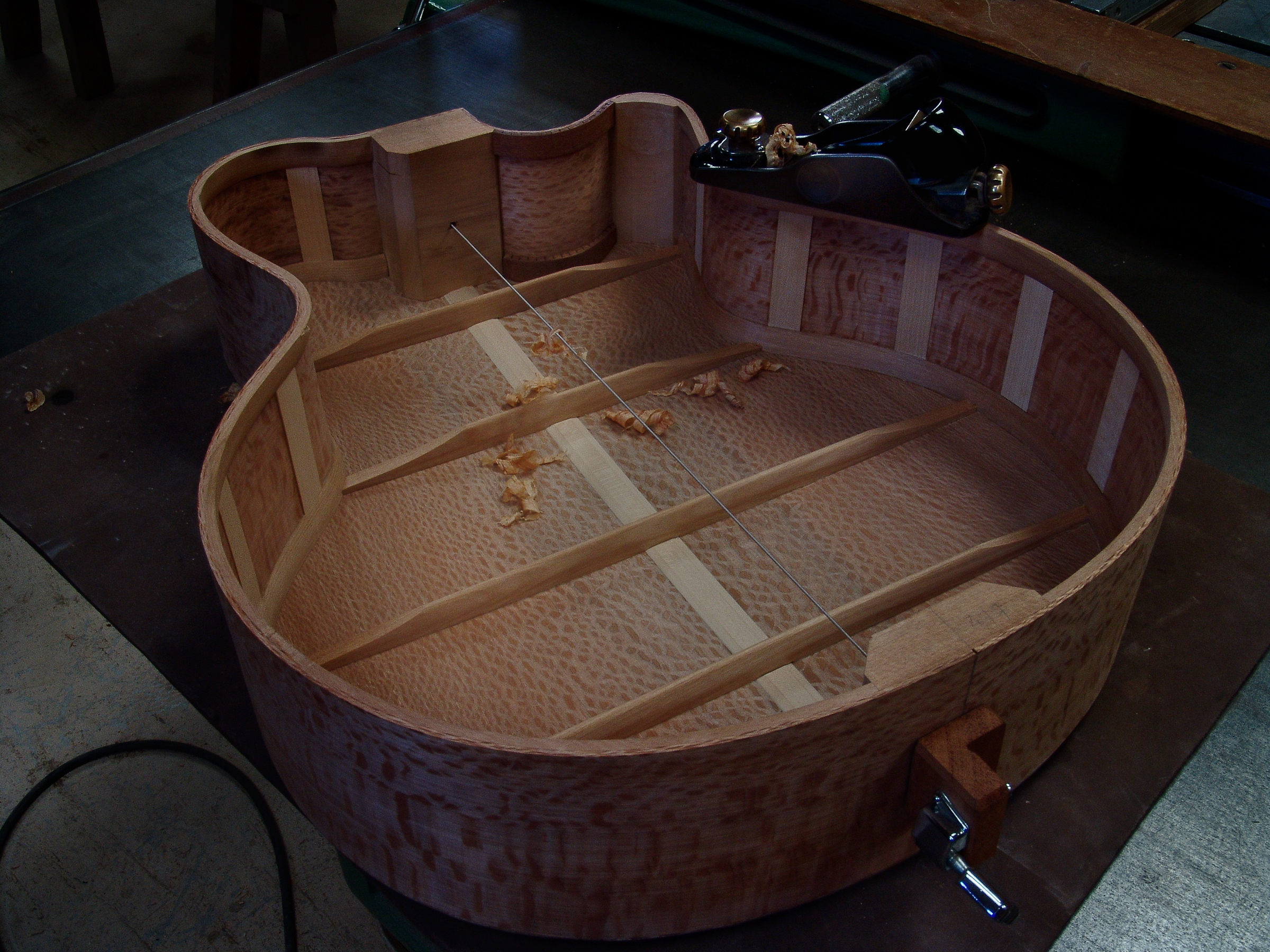 Guitar maker Peter Stephen acoustic cutaway guitar being prepared for the soundboard 