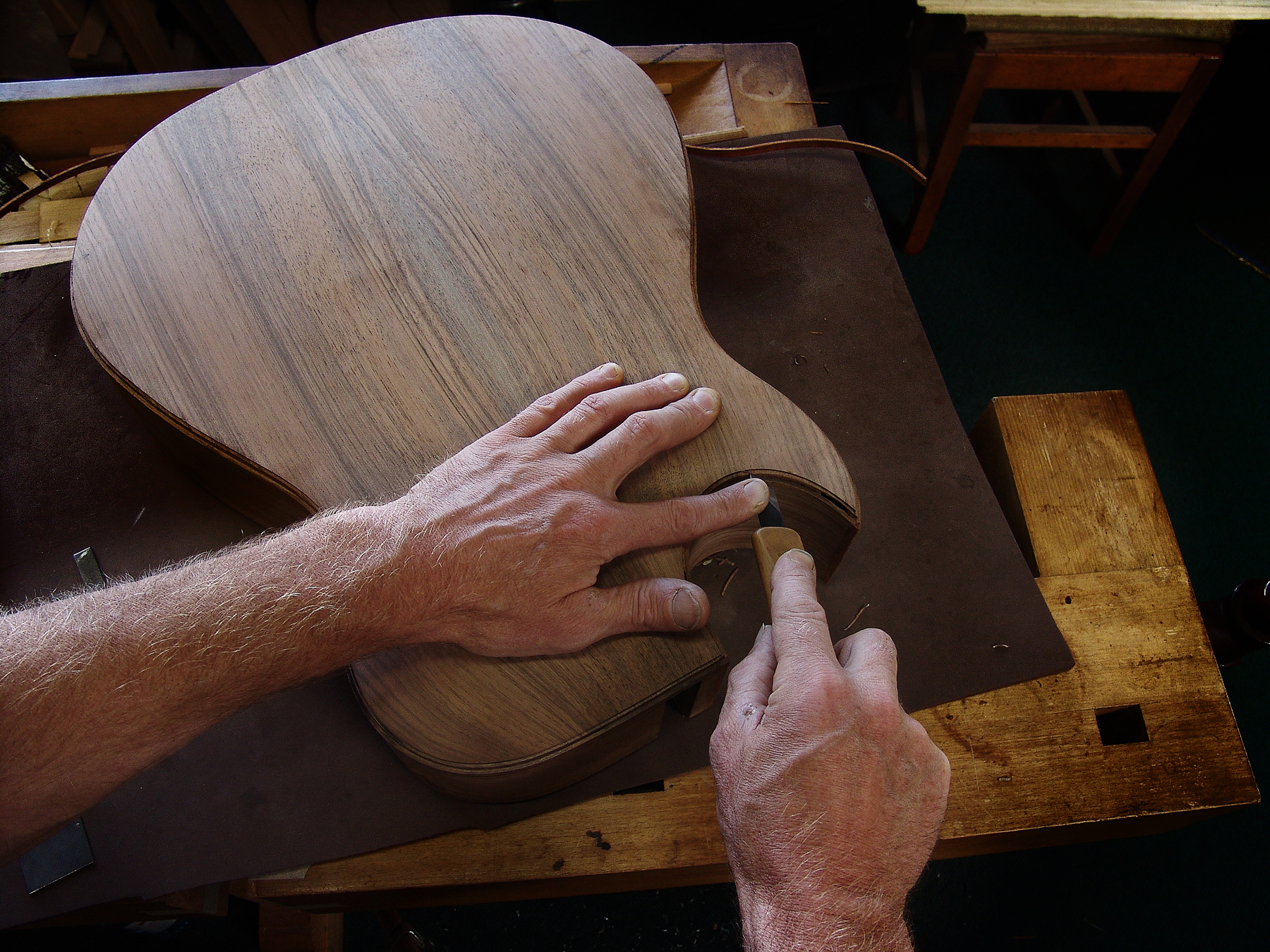 Guitar Maker Peter Stephen is preparing a guitar for its purfling