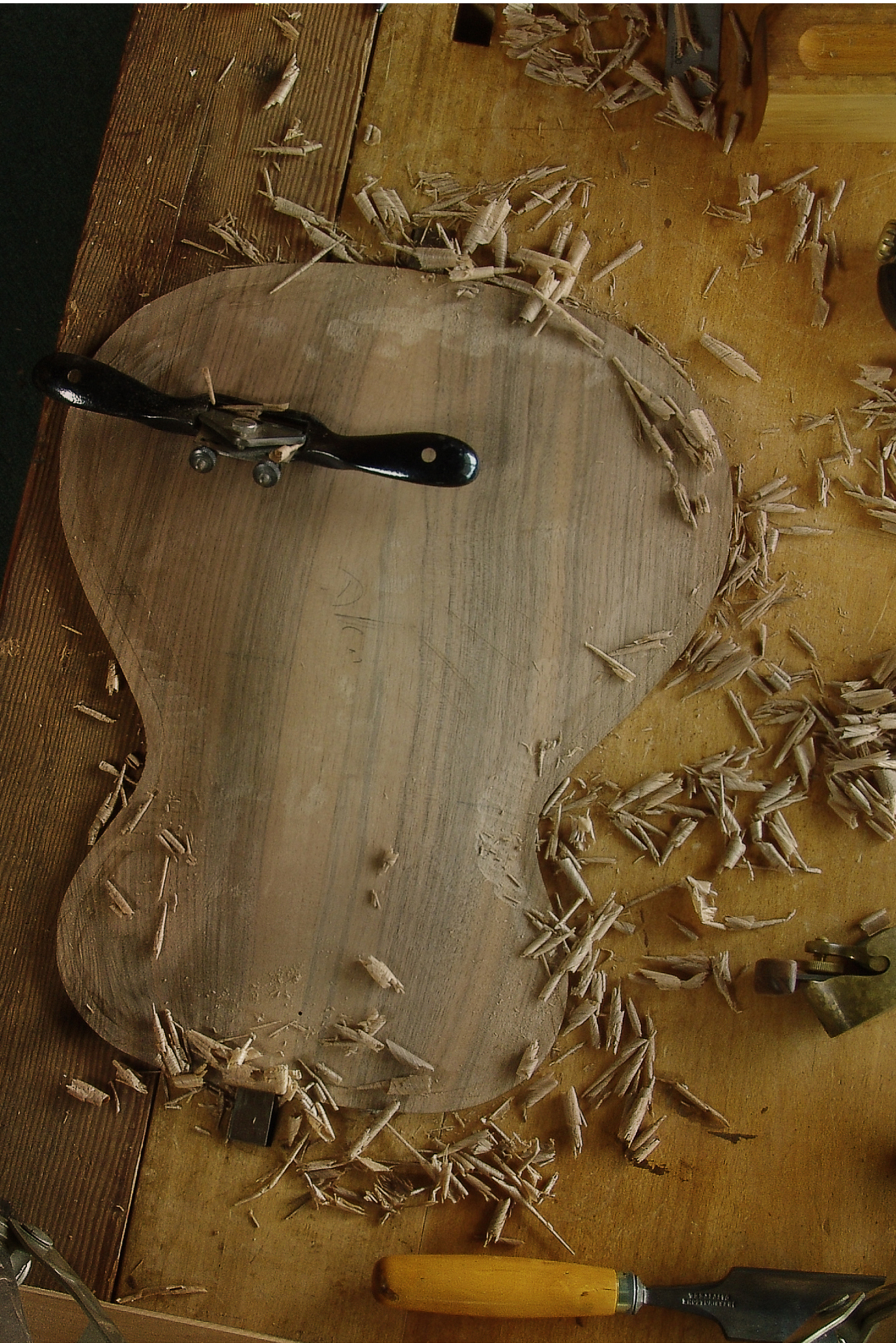 Luthier Peter Stephen, shaping the archtop soundboard for a semi acoustic guitar