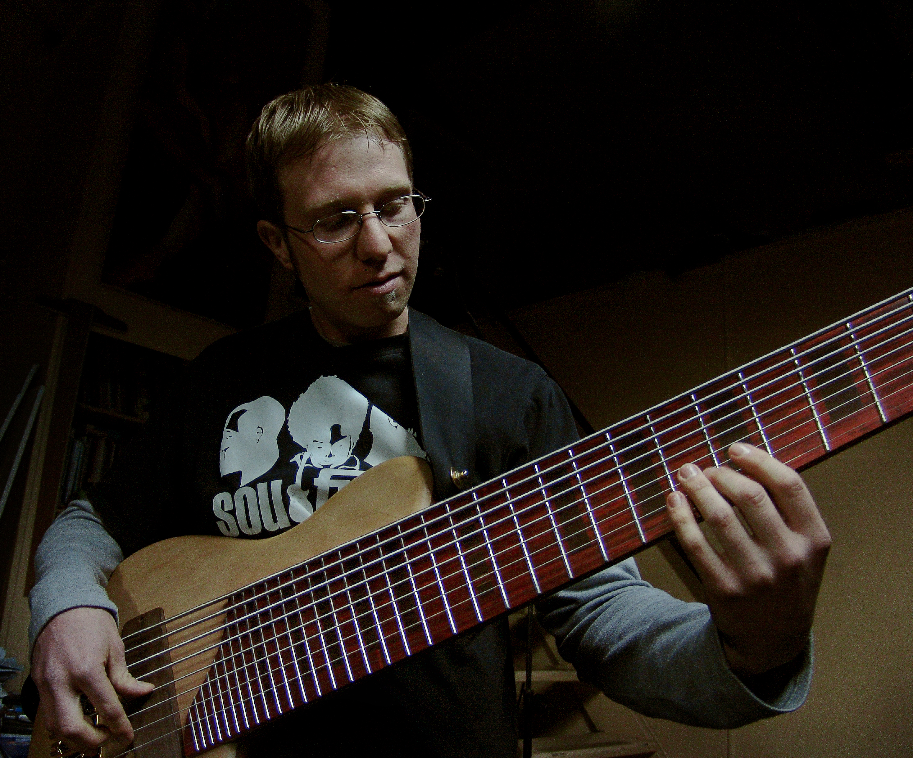 A Peter Stephen 9 String electric bass guitar being played in his studio
