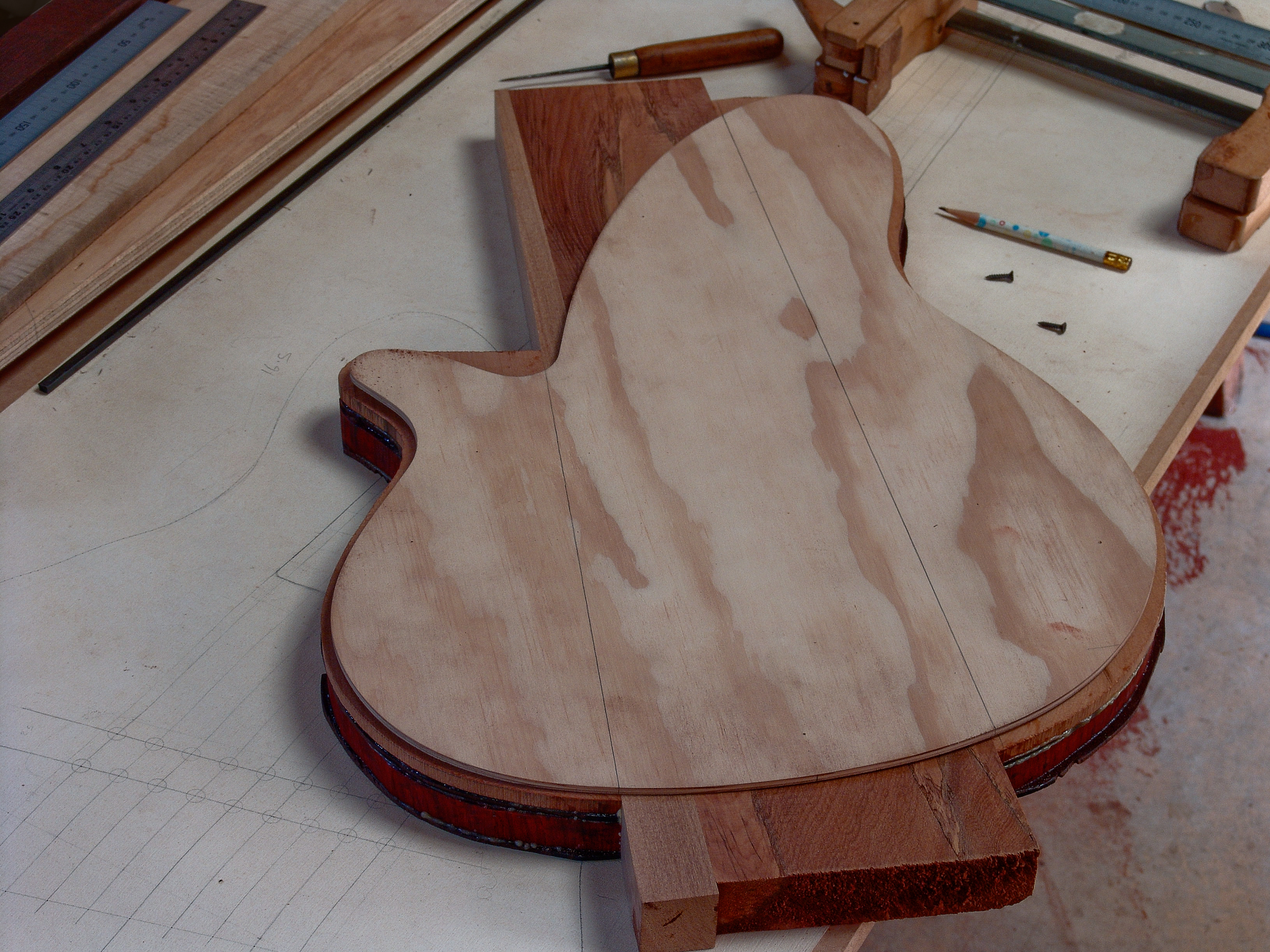 Peter Stephen has cut out the body for Dave Coopers 9 String electric bass guitar