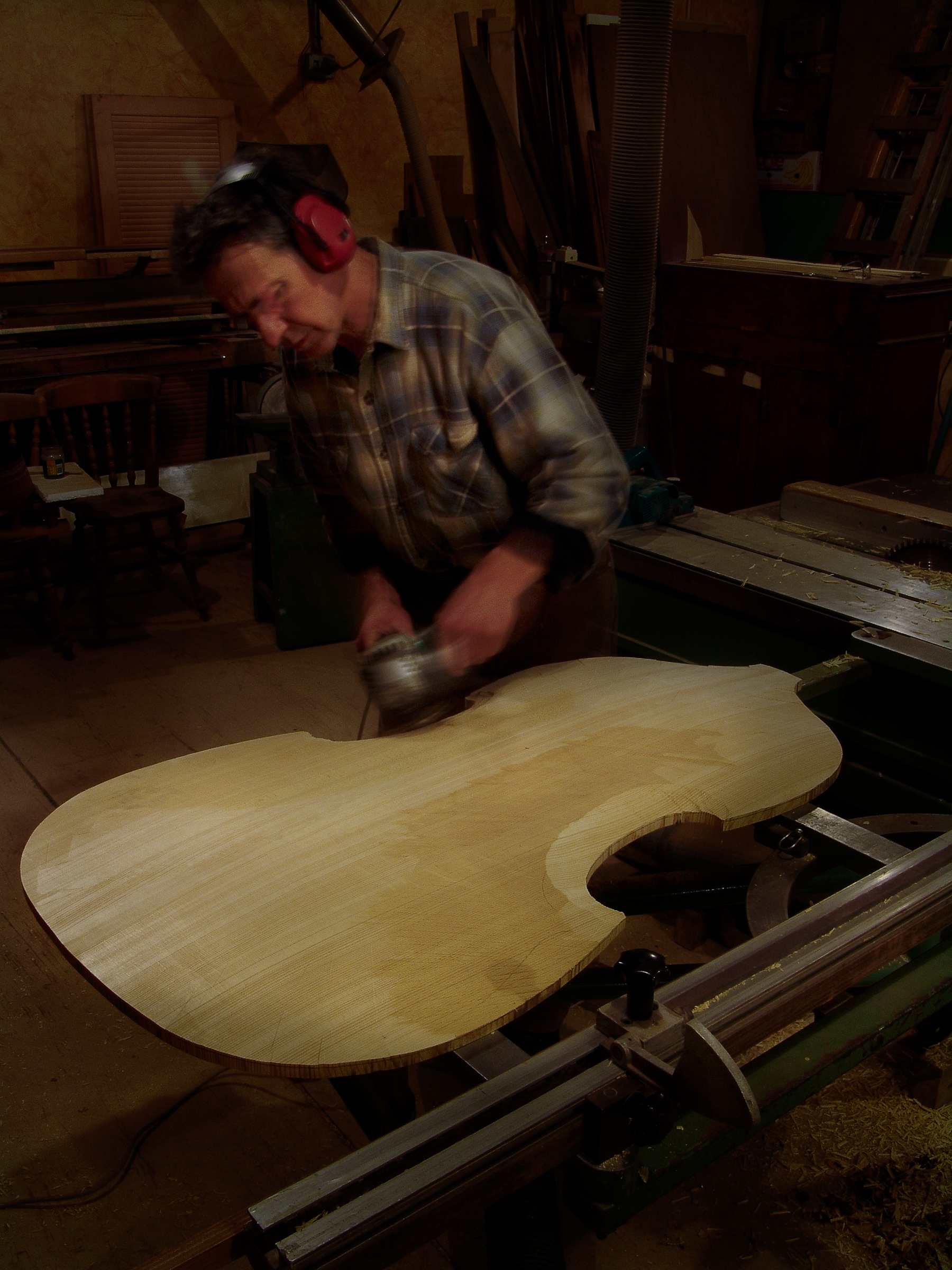 Peter Stephen shaping a soundboard for a double bass