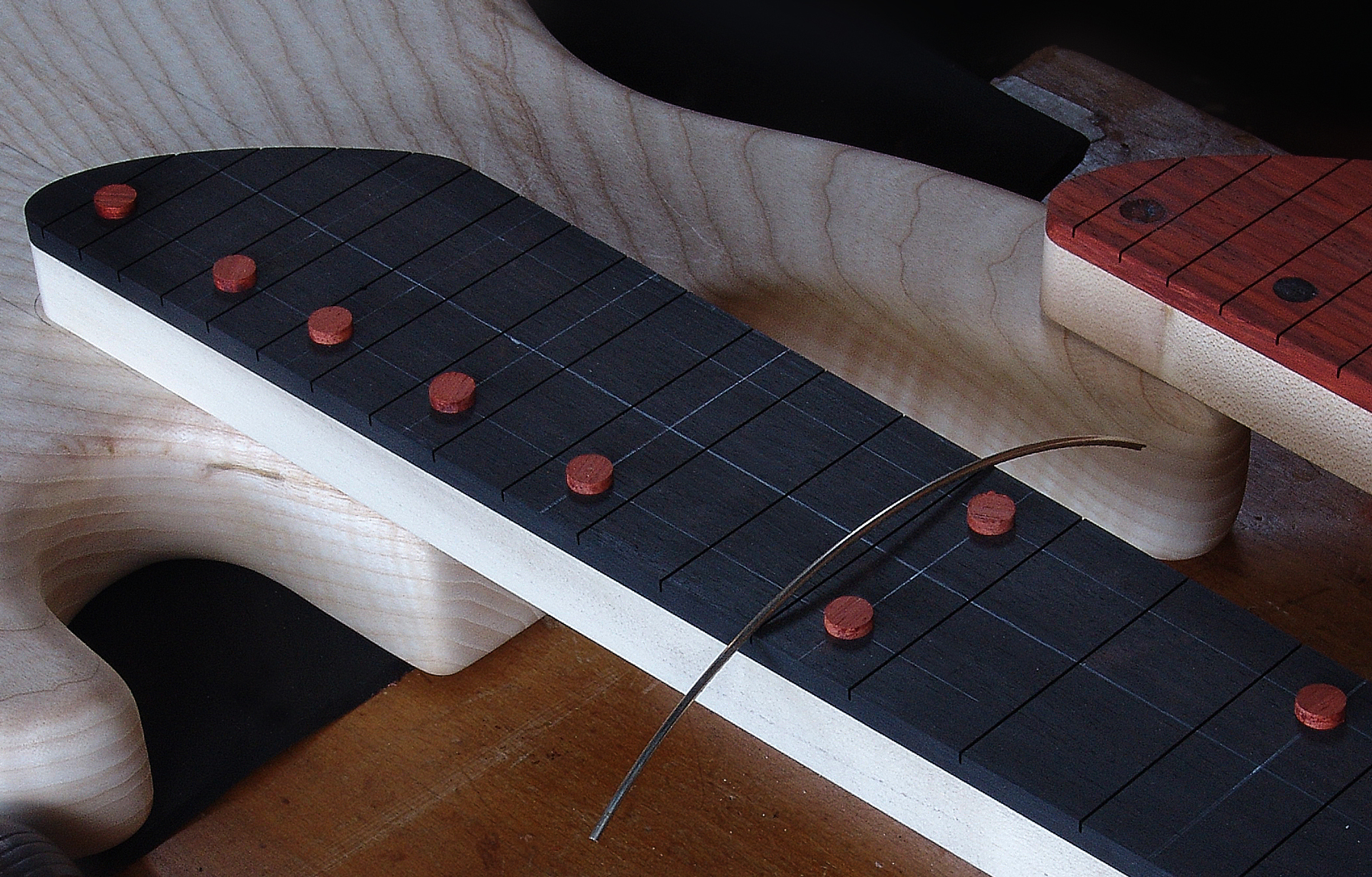 Guitar maker Peter Stephen lays out the components of an electric bass guitar