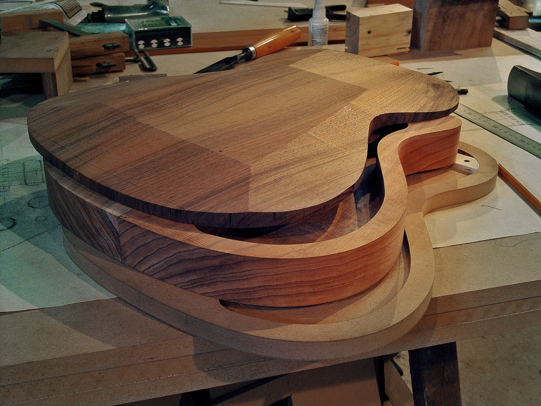 Luthier Peter Stephen assembles the back, sides and soundboard of a semiacoustic electric guitar