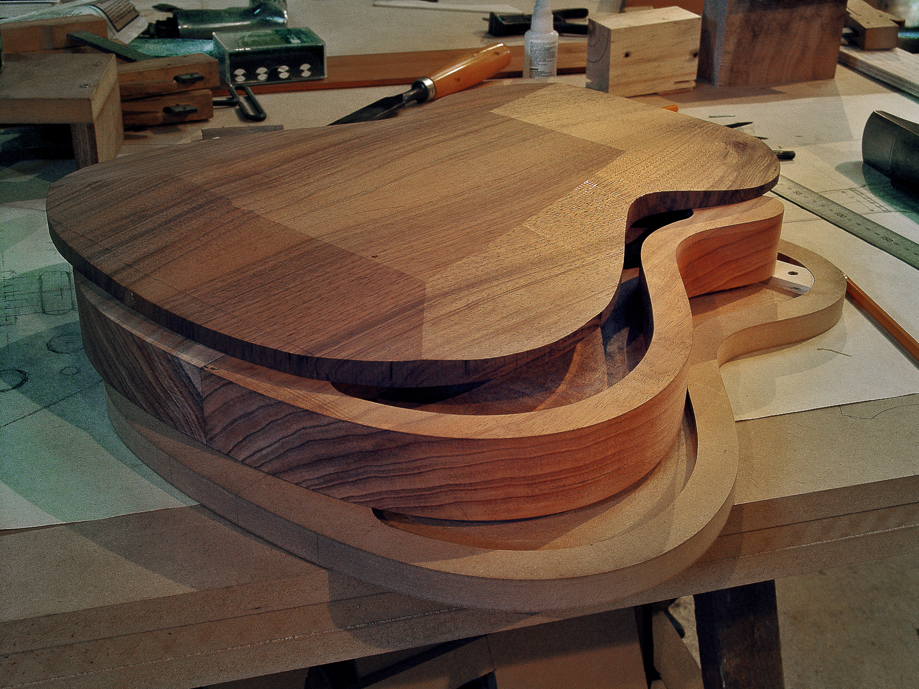 Guitar Maker Peter Stephen. Gibson style electric solid body guitar body being setup ready for assembly