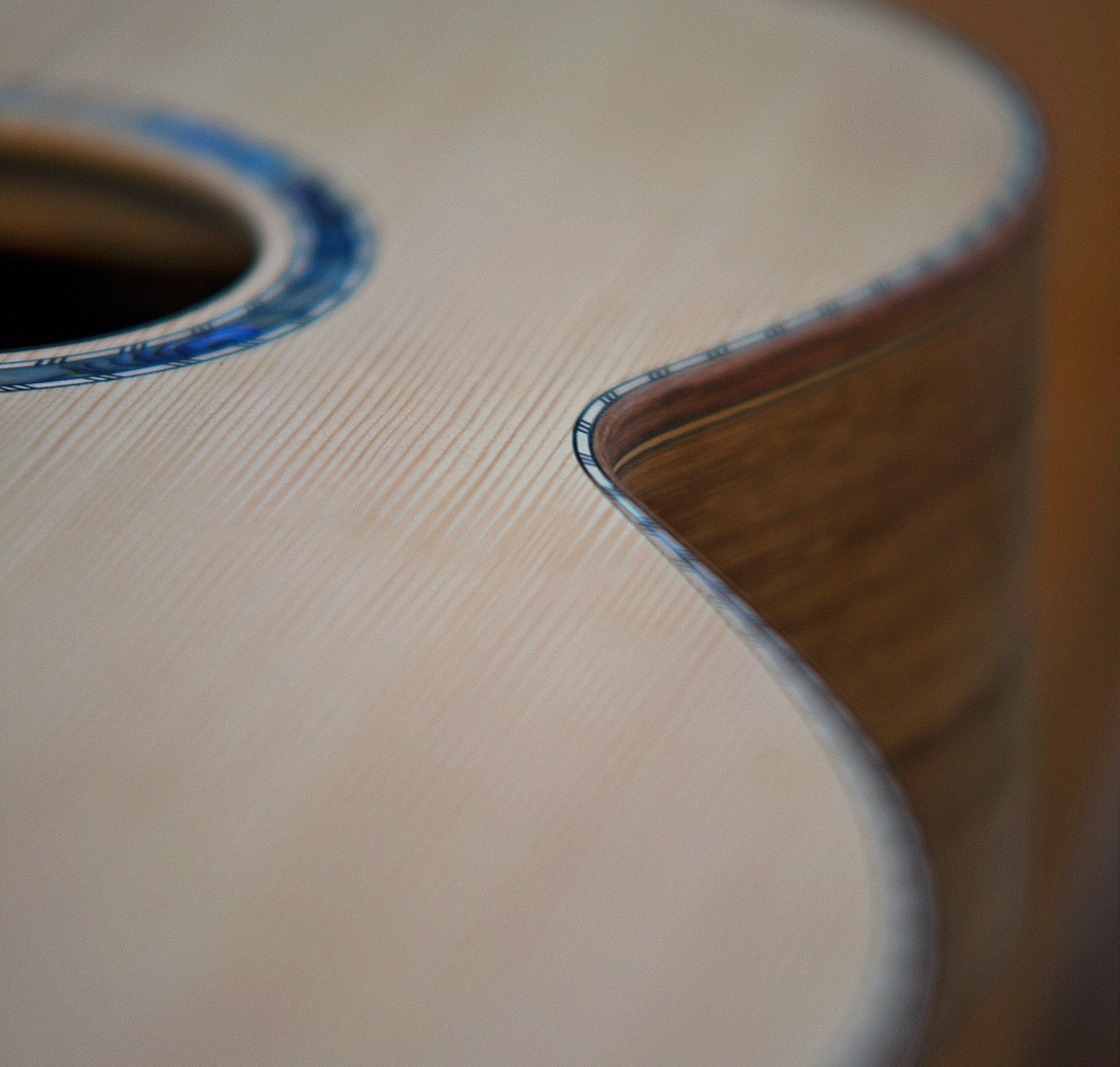 Paua inlay and toothed inlay on one of one of Peter Stephens acoustic guitars
