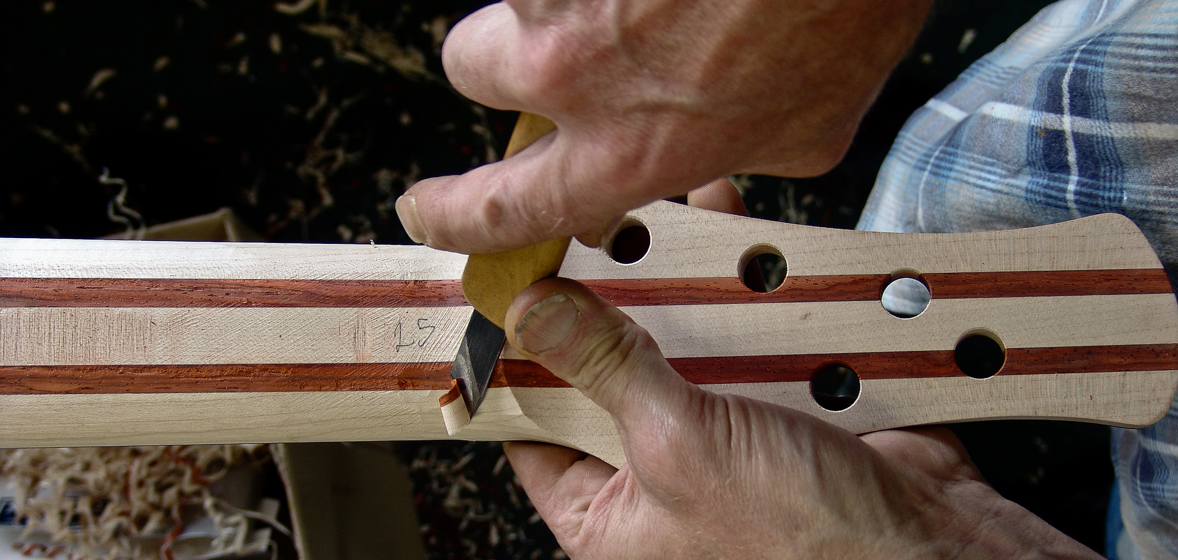Peter Stephen shapes the neck with tradional tools