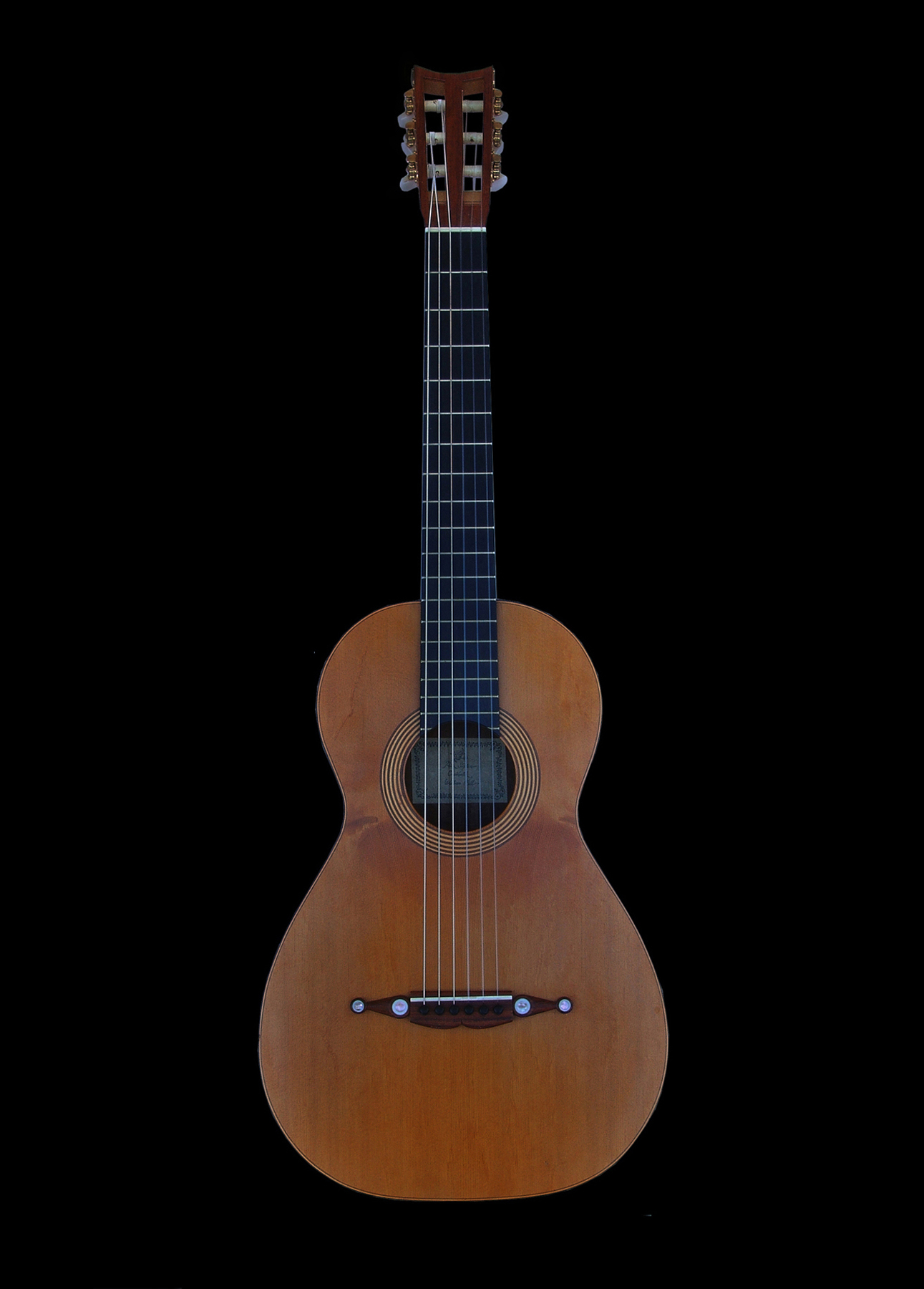 Peter Stephen parlour guitar featuring classic button bridge detailing
