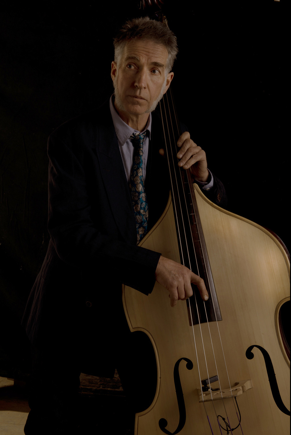 Guitar maker Peter Stephen playing music on a hand made double bass