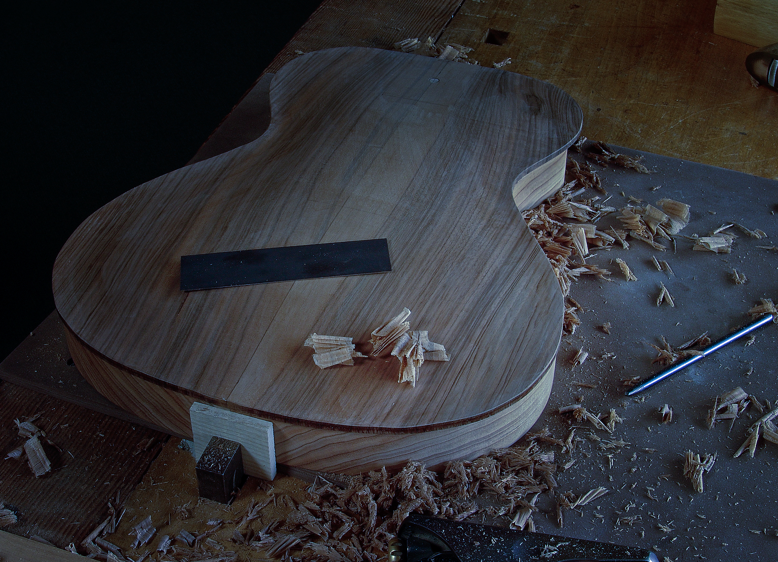 Guitar Maker Peter Stephen. Gibson 335 style electric solid body guitar body being worked on